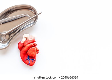 Surgical Instruments And Heart Model. Heart Surgery Concept