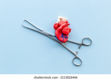 Surgical Instruments And Heart Model. Heart Surgery Concept