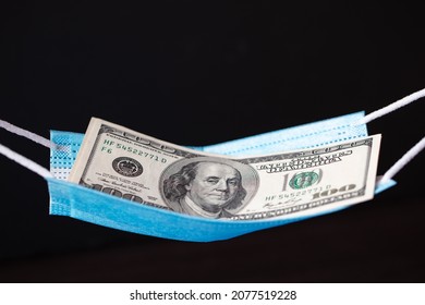 Surgical Mask As Hammock With 100 Dollar Banknotes