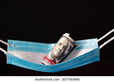 Surgical Mask As Hammock With 100 Dollar Banknotes