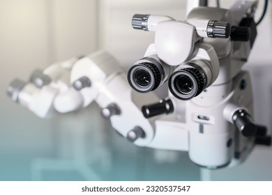 Surgical microscope in operating room with doctors. Ophthalmological clinic. - Powered by Shutterstock