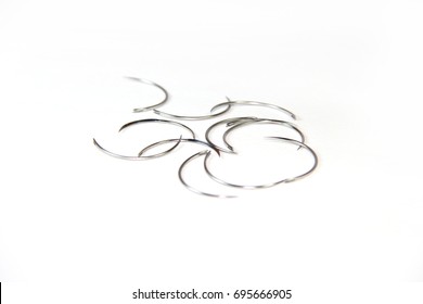 Surgical Needles On White Background Shallow DOF.