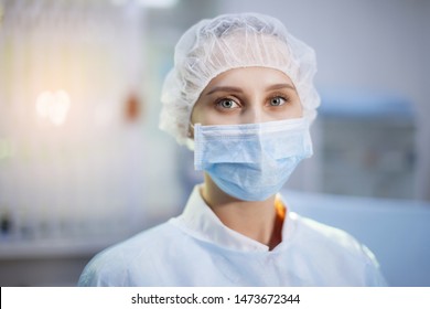 Surgical Nurse In Cap And Mask In Medical Clinic. Close-up Portrait. Health Care, Surgery.