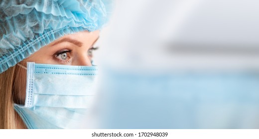 Surgical Nurse Or Doctor With Face Mask And Cap. Health Care, Surgery. Close Up Portrait Of Young Caucasian Woman Model On White Background