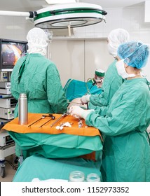 Surgical room during the laparoscopic operation. Professional doctors and nurse provide surgery in internal organs of patient - Shutterstock ID 1152973352