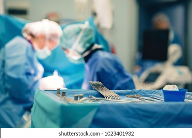 Surgical room in hospital with medical team of surgeons doing minimal invasive surgical interventions. Surgery operating room with electrocautery equipment for cardiovascular emergency surgery center
