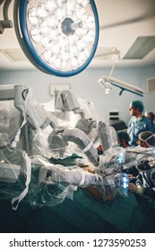 Surgical Room In Hospital With Robotic Technology Equipment, Machine Arm Surgeon In Futuristic Operation Room. Minimal Invasive Surgical Medical Robot,  Urology Surgery With Robotic Assisted Surgeon