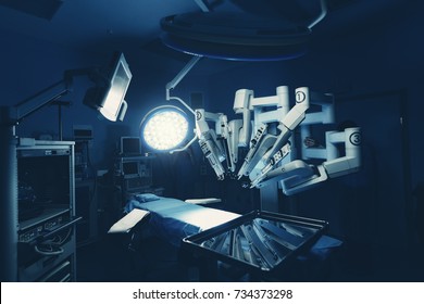 Surgical room in hospital with robotic technology equipment, machine arm surgeon in futuristic operation room. Minimal invasive surgical inoovation, medical robot surgery with 3D view endoscopy