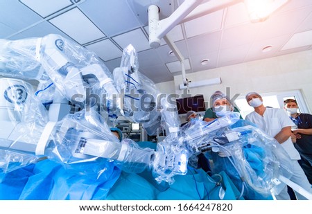 Surgical room in hospital with robotic technology equipment. Minimally invasive surgical innovation, medical robot surgery with 3D view endoscopy