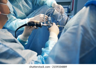 Surgical Specialists Regulating Laparoscopic Instrument During Operation