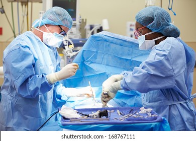 Surgical Team Working In Operating Theatre