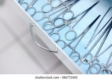 Surgical/ Veterinary Surgical Tools Lying In Drawer. Steel Medical Instruments Ready To Be Used. Surgery And Emergency Concept