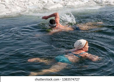 Surgut, Russia, 27 Apr 2019: Women And Men Of All Ages - Members Of The Club Of Lovers Of Winter Swimming - Walrus Surgut, Happy To Swim In The Icy Water.