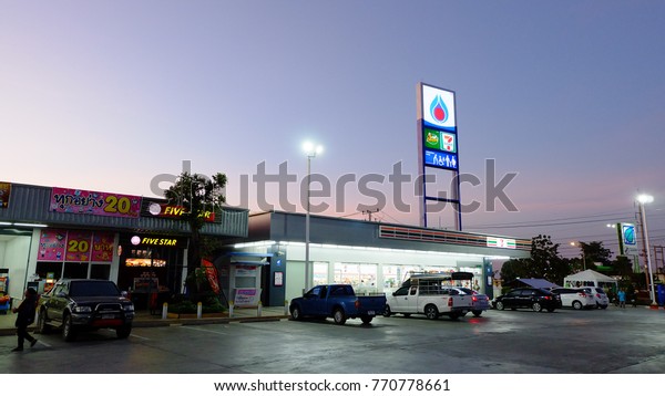 Surin,\
Thailand - December 7, 2017: PTT gas station logo and store shop\
light box logo in side the gas station at night.\
