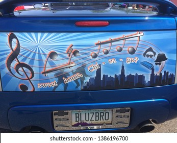 Surprise, Arizona / USA-May 26, 2018: Closeup Of A Blue Tailgate Of A Chevrolet At An Outdoor Car Show, With Musical Notes, Caricature Of The Blues Brothers, Skyline And Sweet Home Chicago Words