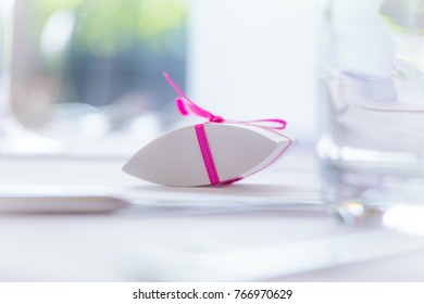 Surprise Cute Valuable Luxury Present With Loop On Perfect Table. Perfect Gift For E.g. Christmas Valentine's Day Baptism Bithday Or Engagement. Also A Symbol For Corruption Bribery Or A Small Graft