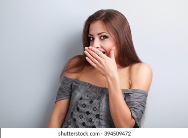 Surprise Makeup Woman Cover Mouth The Hand And Looking With Big Eyes On Blue Background