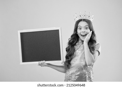 Surprise prom night. Prom queen hold school blackboard. Small child wear prom crown. Coronation party. Holiday celebration. Pride and glory. Prestige and fame. Prom information, copy space