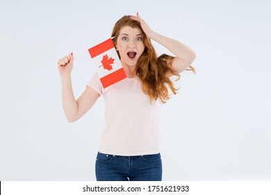 Surprise Woman With The Flag Of Canada On A Light White Background. Portraits Canadian Female Student. 