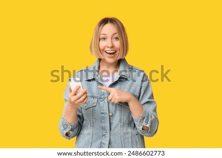 Similar – Pretty woman with OKAY sign, ok gesture. Happy lady, correct choice, yellow wall