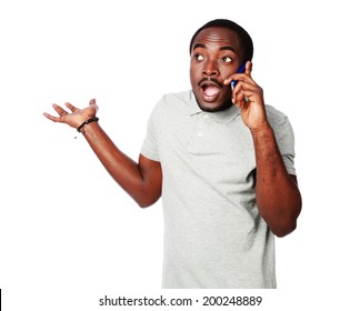 Surprised African Man Talking On The Phone Isolated On A White Background