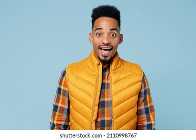 Surprised Amazed Exultant Excited Happy Young Black Man 20s Years Old Wears Yellow Waistcoat Shirt Looking Camera Keeping Mouth Wide Open Isolated On Plain Pastel Light Blue Background Studio Portrait