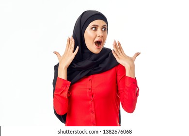    surprised arab woman in black burqa on isolated background                           