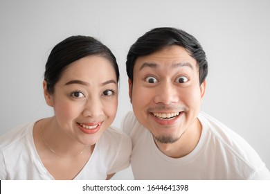 Surprised Asian Lover Couple Funny Face In White T-shirt And White Background.