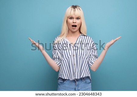 surprised blonde young female adult in blouse isolated background
