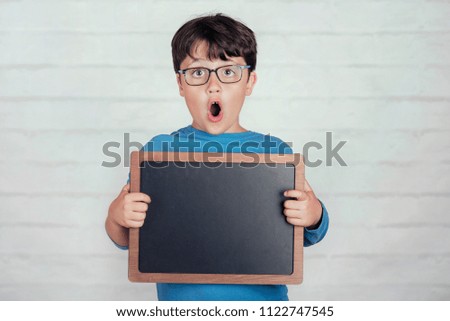 Similar – surprised boy with a blackboard