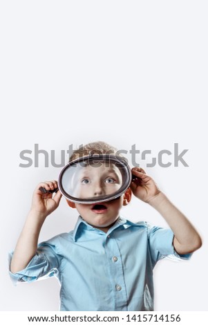 Similar – funny child with clown nose on blue background