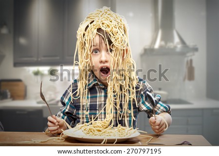 Surprised boy with pasta on the head
