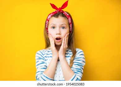 Surprised Child Girl On Yellow Background. Menstrual Period For The First Time Concept