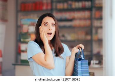 
Surprised Customer Holding A Shopping Bag In A Pharmacy. Woman Having Mixed Feelings About Sales And Offers In A Drug Store
