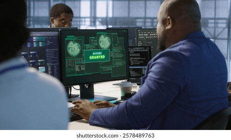 Surprised data center technician celebrating after successfully managing to install cybersecurity framework, reducing security incidents and enhancing data protection protocols, camera A