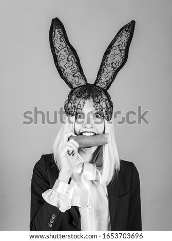 Similar – Young woman wearing rabbit ears and kissing