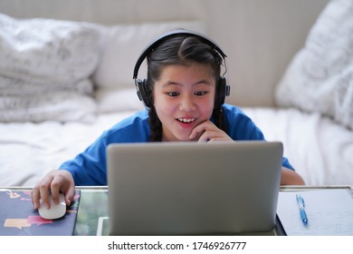 Surprised E-learning Tween Girl Online Study At Home Computer