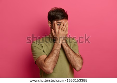 Similar – Image, Stock Photo Man covering himself with summer hat at countryside.