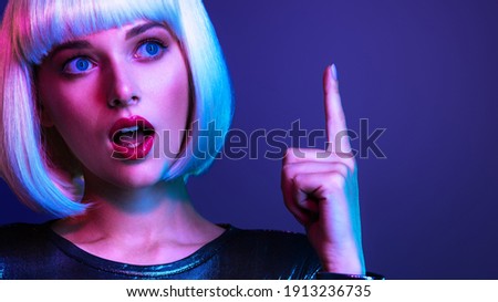 Similar – Young blonde woman asking for silence