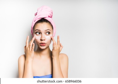 Surprised face woman touch patches under eyes,isolated.Beauty sk