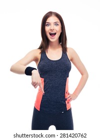 Surprised Fitness Woman Pointing Finger Down Isolated On A White Background. Looking At Camera