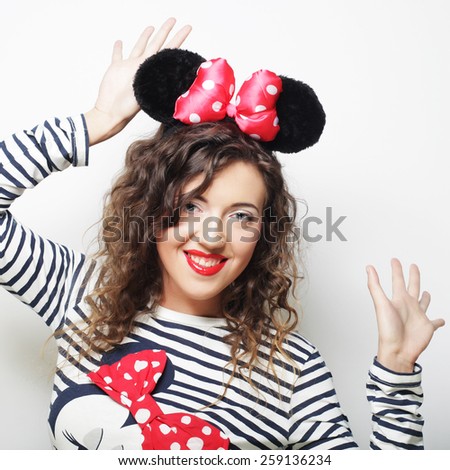 Surprised funny young woman with mouse ears