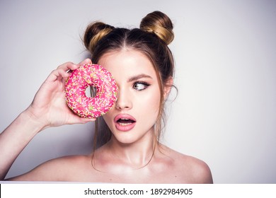 Surprised Girl With Pink Donut In Studio