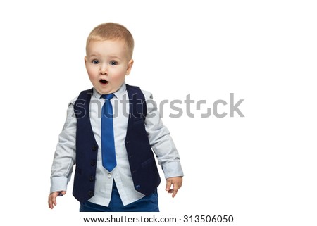 Surprised handsome little boy in business suit with open mouth. True emotion. Isolated over white background. Copy space.