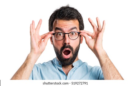 Surprised handsome man showing something - Shutterstock ID 519272791