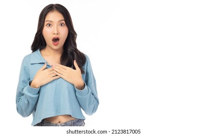 Surprised happy beauty asian woman looking camera in excitement with mouth open Expressive facial expressions. Beautiful girl act like a satisfied product Isolated on yellow background