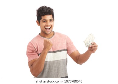 Surprised Indian Young Man With Indian Rupees On White.