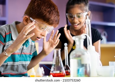 Surprised Kid over science experiment result or chemical reaction at chemistry laboratory - concept of childhood excitement, learning new skills and education. - Powered by Shutterstock