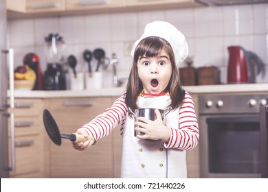 Surprised Little Girl Chef Having A Funny Reaction