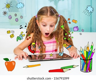 Surprised little girl and her magic tablet